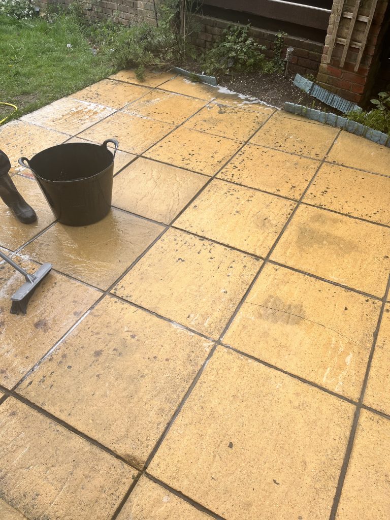 Large patio being cleaned with chemicals