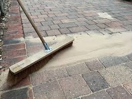 Finishing driveway with addeing sand